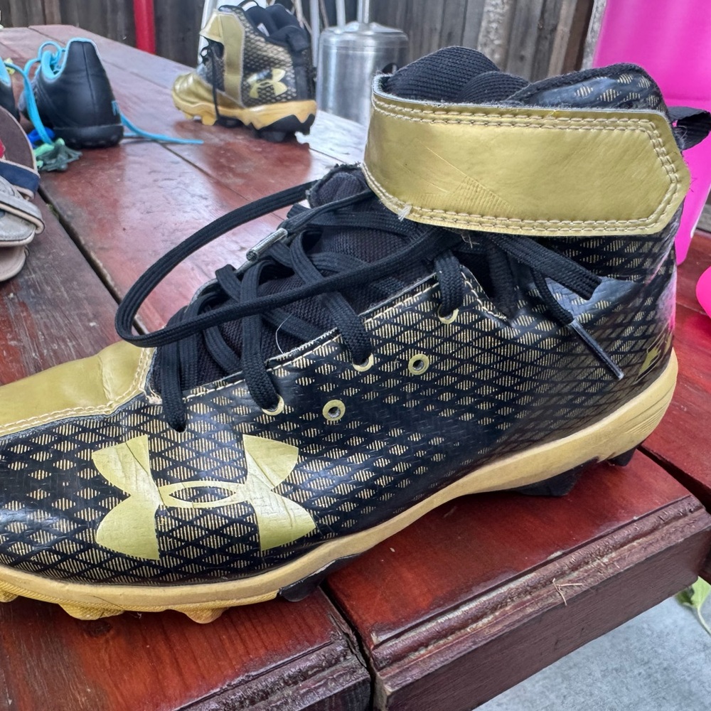 Under Armour Kids Black and Gold Cleats